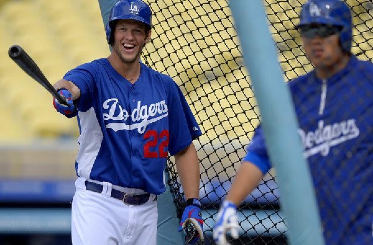 Dodgers starting pitchers Clayton Kershaw (22) and Ryu Hyun-Jin take batting practice before Tuesday's game against the Diamondbacks.