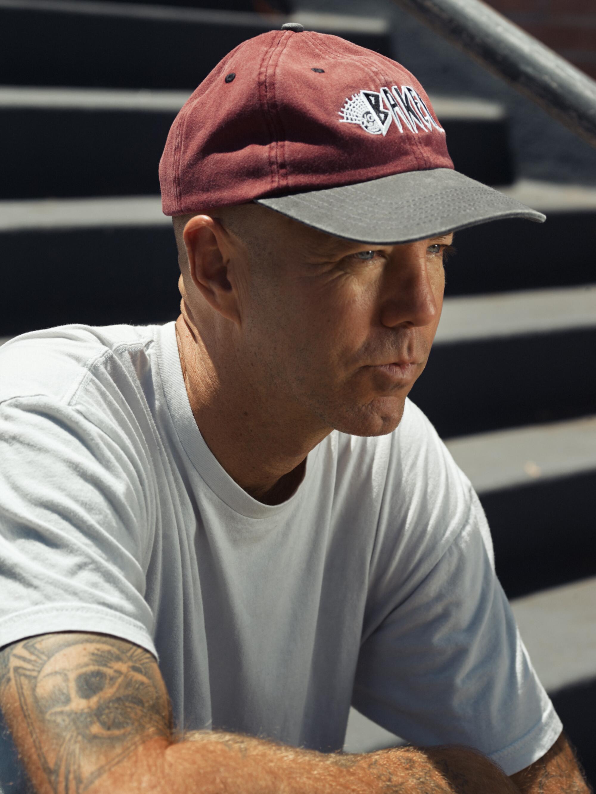 Pro skater Andrew Reynolds sits on the Hollywood High stairs.