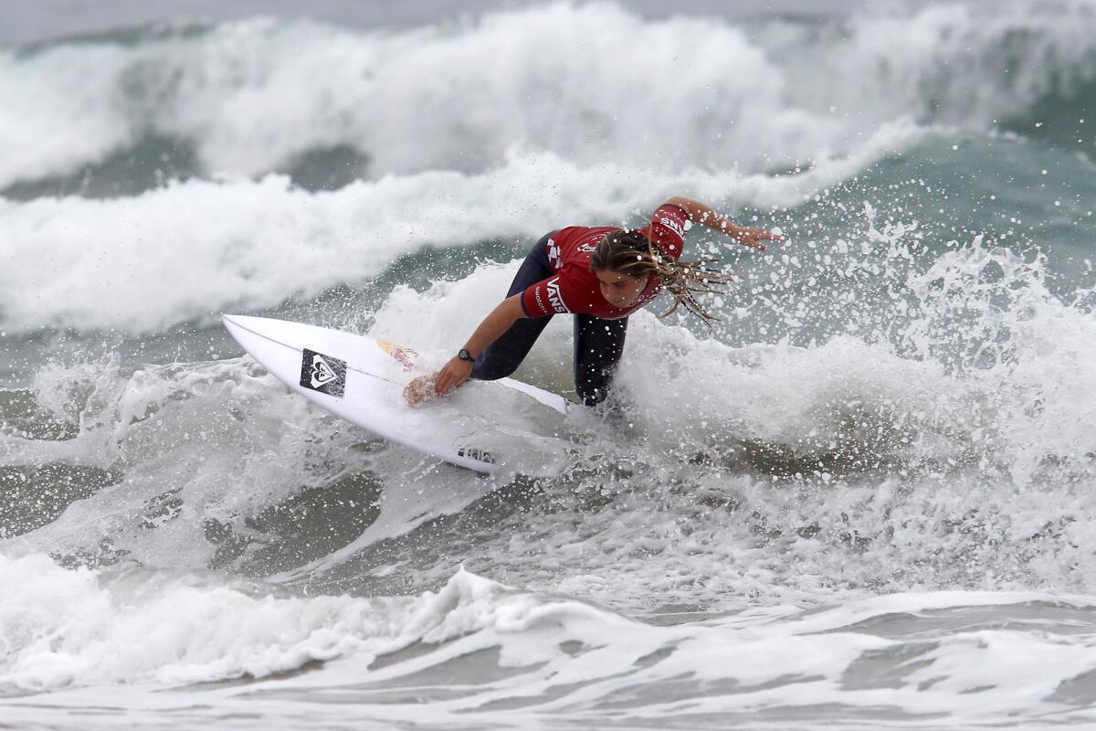 Caroline Marks of San Clemente competes during Heat 1 in the U.S. Open of Surfing Women's Round 3 competition at Huntington Beach Pier on Thursday.