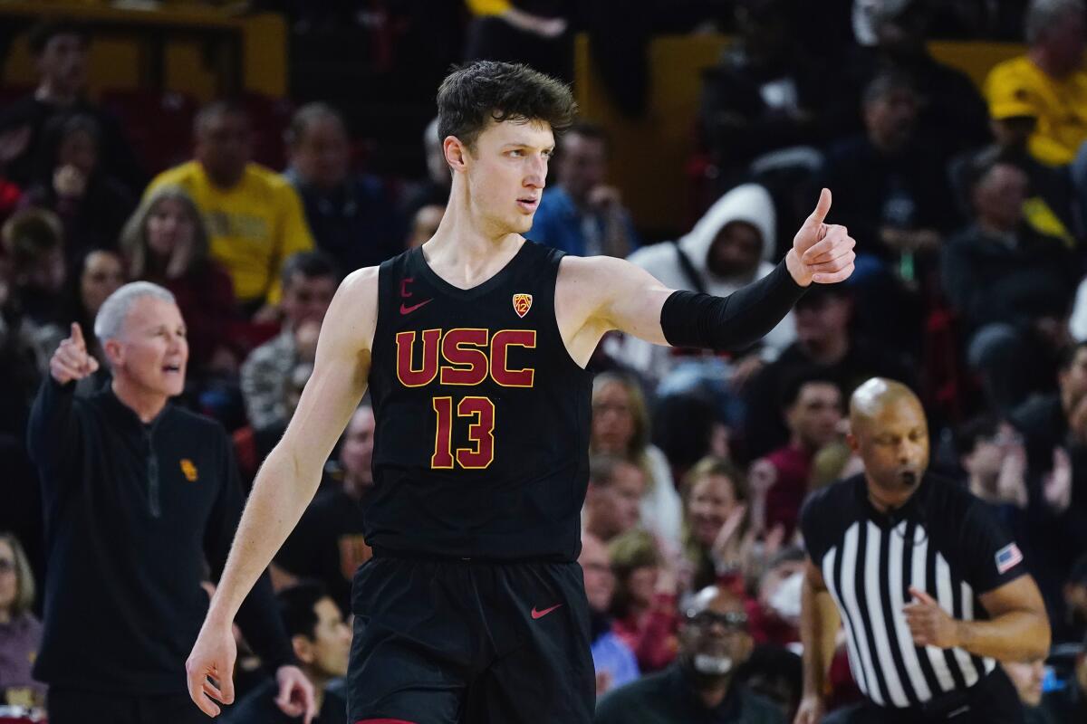 USC guard Drew Peterson acknowledges a teammate after scoring during the second half of the Trojans' 77-69 victory.