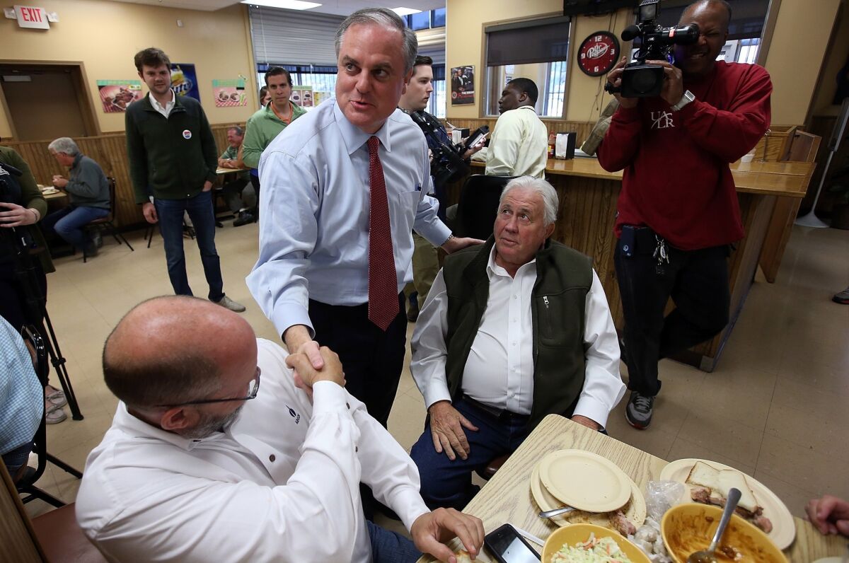Mark Pryor lost his bid for reelection to the U.S. Senate in Arkansas. Above, he greets voters in Little Rock on Tuesday.