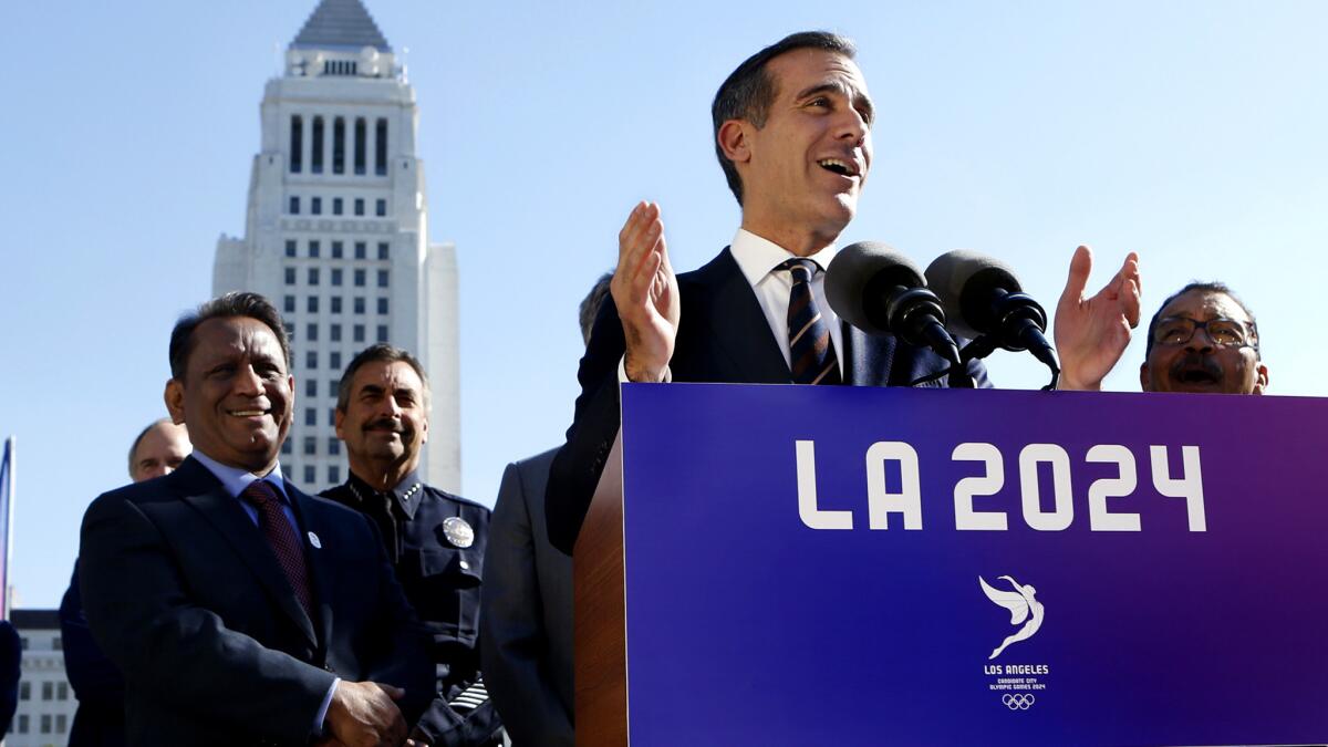 Mayor Eric Garcetti speaks at a news conference after the City Council gave its final approval to a proposal that could bring the 2024 Olympic Games to Southern California in 2024.