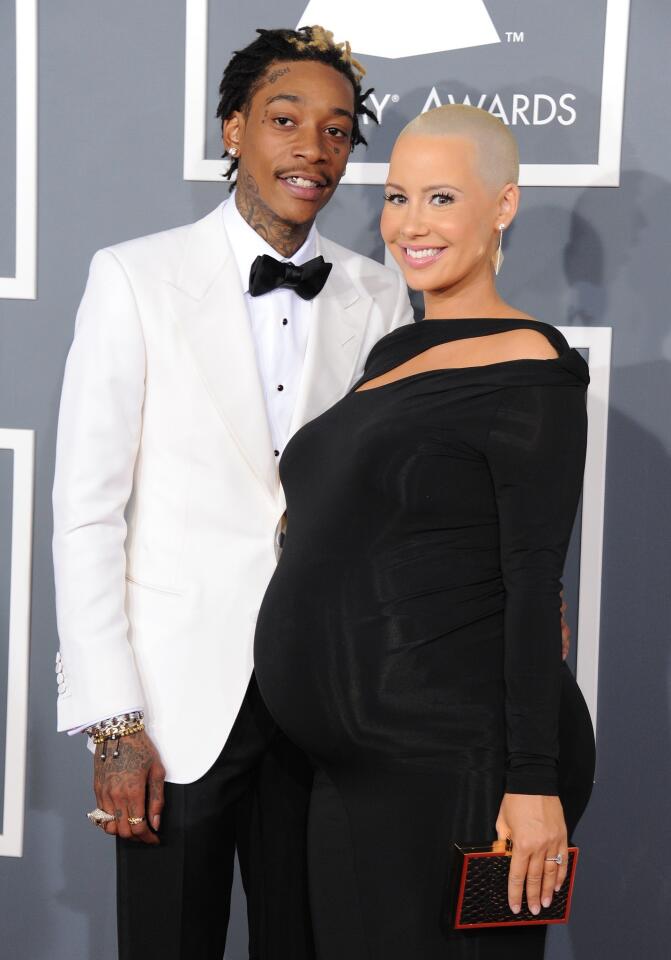 Wiz Khalifa and Amber Rose are proud parents of a new baby boy, born Thursday afternoon. "Happy Birthday Sebastian 'The Bash' Taylor Thomaz!!!," Khalifa posted on Twitter. "Everyone welcome this perfect young man into the world." He'd prepped fans for the news by tweeting a picture of himself in surgical cap and mask a bit earlier in the day, along with the message, "Daddy time." Dad's birth name is Cameron Thomaz. Full story: Wiz Khalifa and Amber Rose welcome a new baby boy | PHOTOS: The Hollywood baby boom