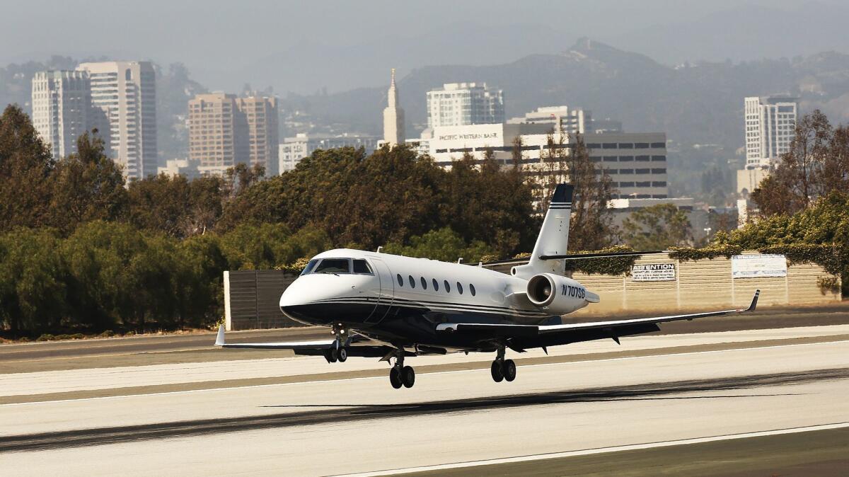 A private jet comes in for a landing at Santa Monica Municipal Airport, which is scheduled to close at the end of 2028.