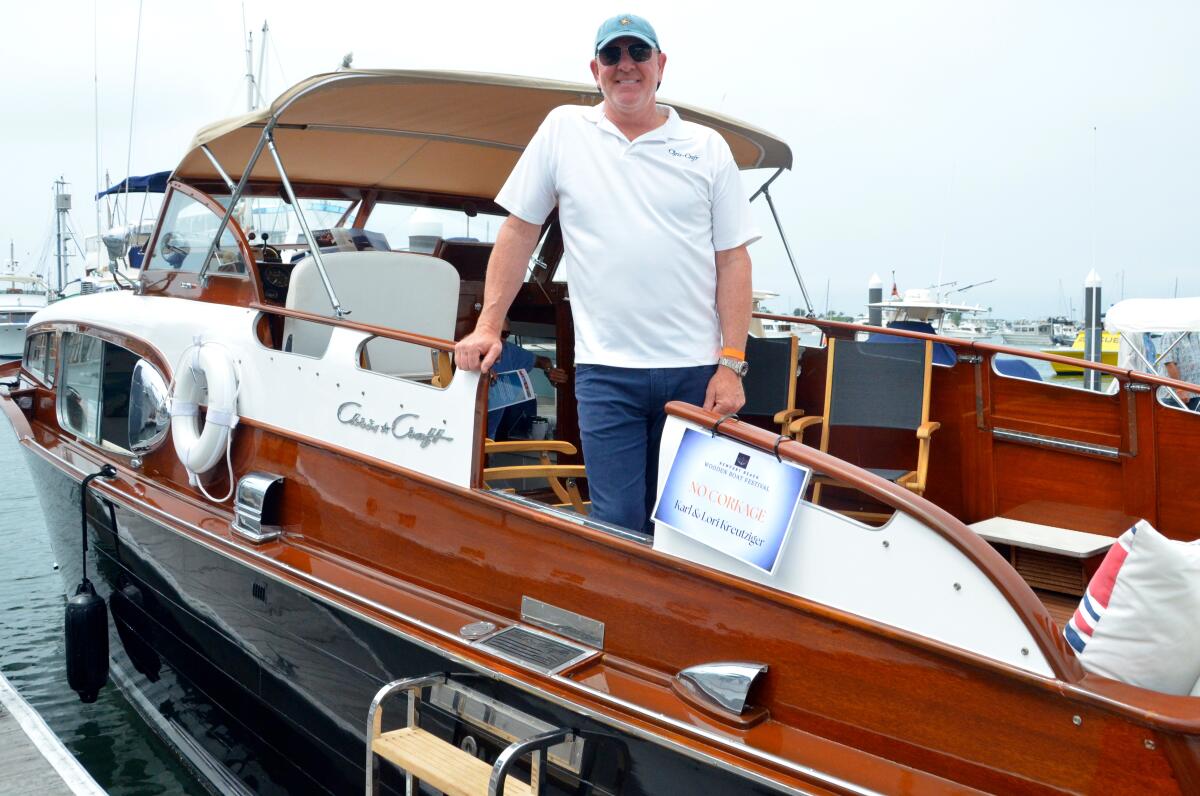 Karl Kreutziger poses aboard his 1954, 36-foot Chris-Craft Commander.