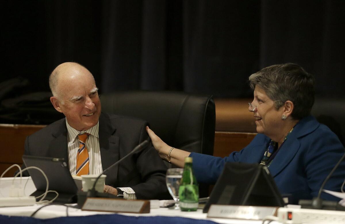 Gov. Jerry Brown, left, smiles next to University of California president Janet Napolitano at a UC Board of Regents meeting in March.