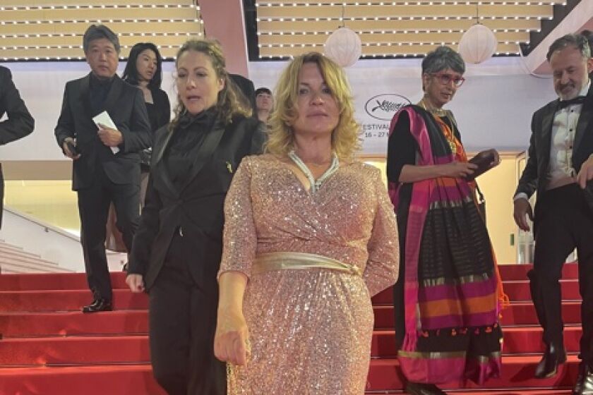 La Jolla resident Nellee Holmes (center) attends the Cannes Film Festival.