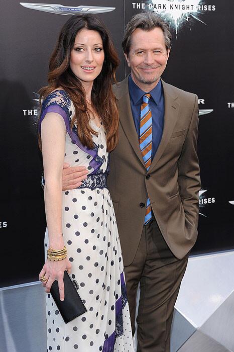 Alexandra Edenborough and Gary Oldman attend "The Dark Knight Rises" premiere.