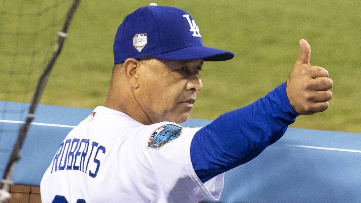 Dodgers manager Dave Roberts gives a thumbs up during Game 5 of the World Series against the Red Sox at Dodger Stadium on Oct. 28.