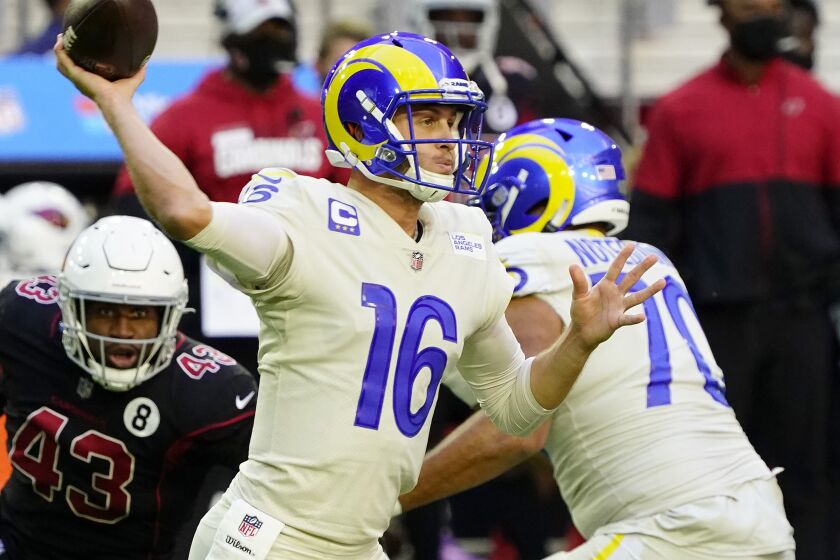 Los Angeles Rams quarterback Jared Goff (16) throws as Arizona Cardinals outside linebacker Haason Reddick.
