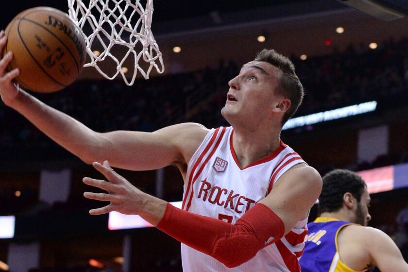 Houston Rockets forward Sam Dekker (7) shoots against the Los Angeles Lakers in the second half of the Rockets' 134-95 victory in an NBA basketball game on Wednesday, Dec. 7, 2016, in Houston. (AP Photo/George Bridges)