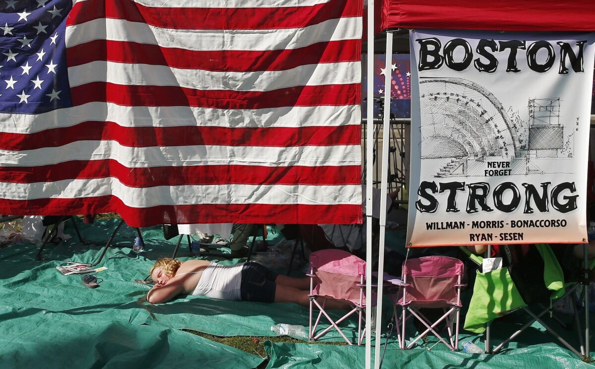 A display honors the victims of the Boston Marathon bombings at a Boston Pops concert on the Fourth of July.