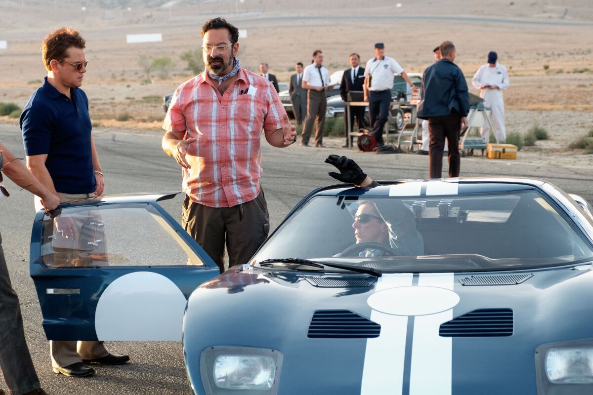 Ford v Ferrari is directed by James Mangold, flanked  here by actors Matt Damon and Christian Bale