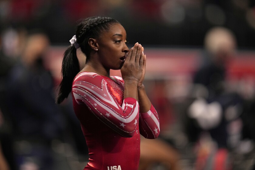 FILE - Simone Biles prepares for the floor exercise during the women's U.S. Olympic Gymnastics Trials in St. Louis, in this Sunday, June 27, 2021, file photo. Biles, the reigning world and Olympic champion, believes the culture within USA Gymnastics is more relaxed now than it was under former national team coordinator Martha Karolyi, maybe too relaxed. (AP Photo/Jeff Roberson, File)