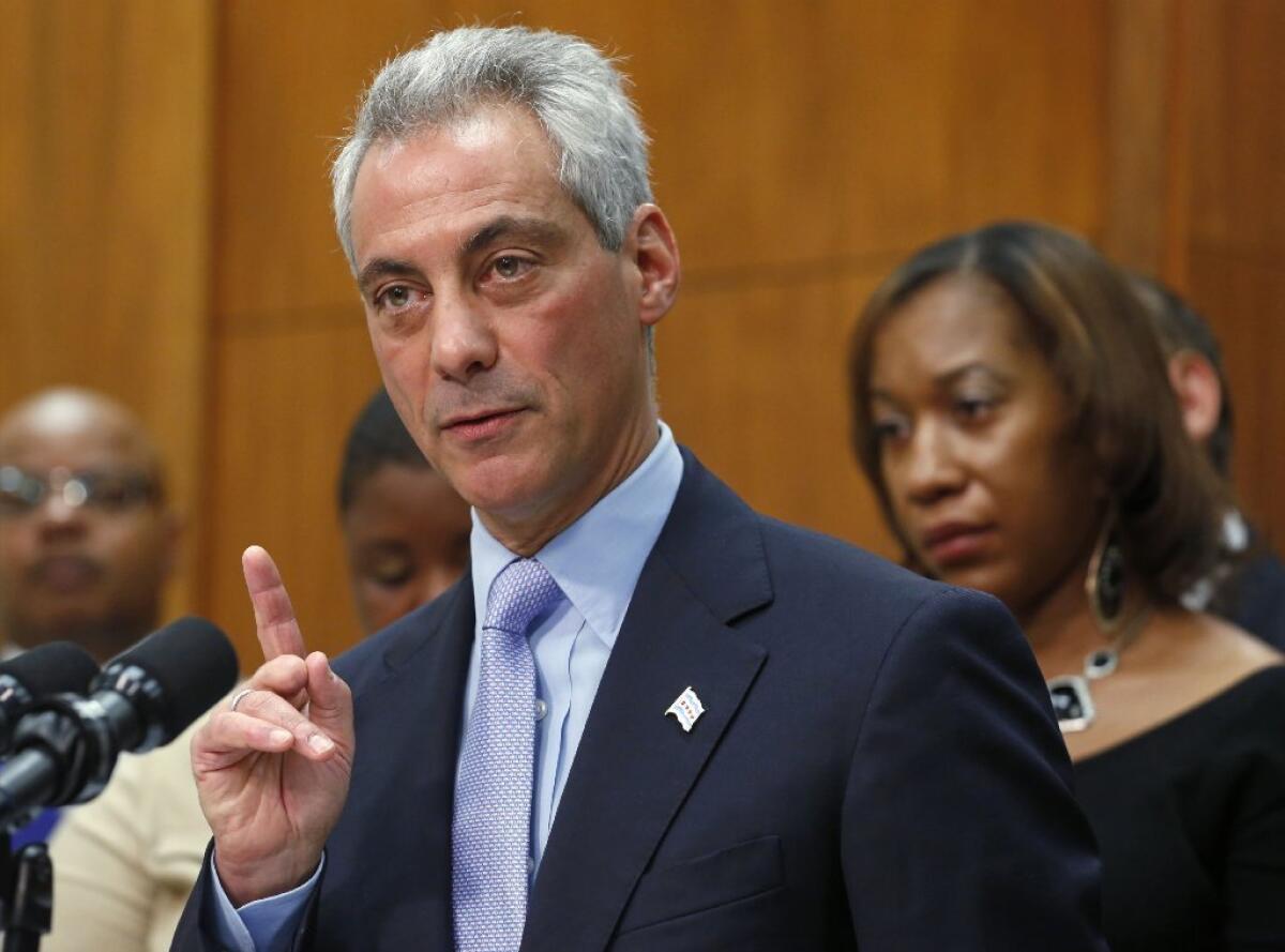 Chicago Mayor Rahm Emanuel speaks at a news conference on Oct. 15 surrounded by the members of families affected by gun violence. He expressed his support for a bill in Illinois to increase sentences for several common gun crimes.
