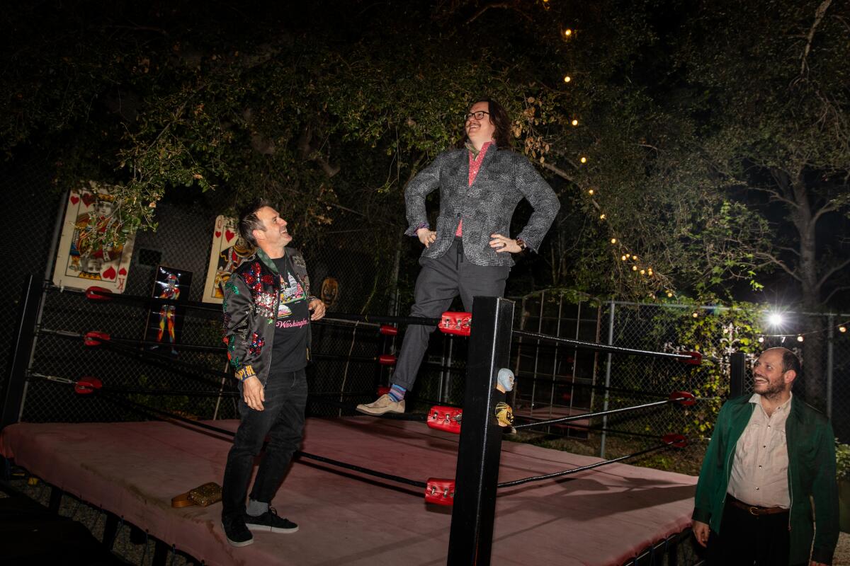 Clark Duke on the ropes of David Arquette's, left, backyard wrestling ring.