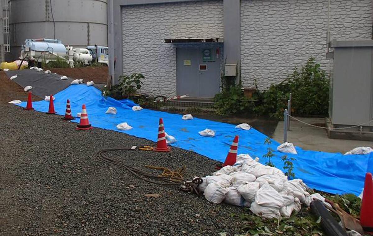 Tarps and barriers are deployed to counter the spread of radioactive water at the crippled Fukushima Daiichi Nuclear Power Plant in Japan.