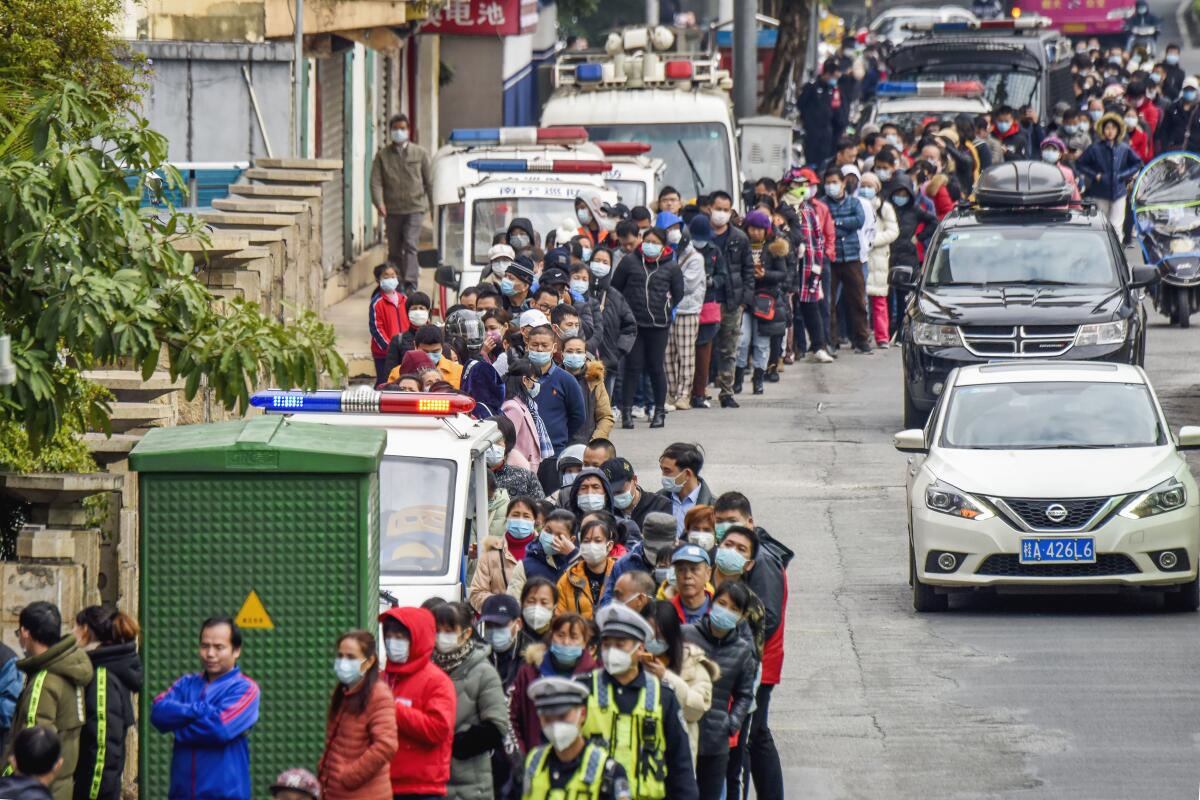 People line up to buy face masks Jan. 29 in Nanning, China.