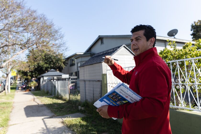 Candidate David Alvarez canvassing in the Barrio Logan neighborhood in an effort to get votes for the vacant seat in the 80th Assembly District, which Lorena Gonzalez stepped down from in January, on Tuesday, April 5, 2022. Alvarez is competing against Democrat Georgette Gómez and Republican Lincoln Pickard.