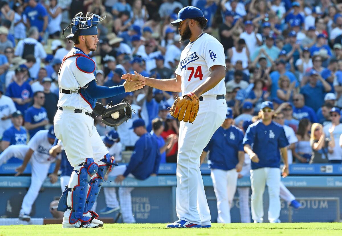 Yasmani Grandal and Kenley Jansen congratulate each other on a job well done.