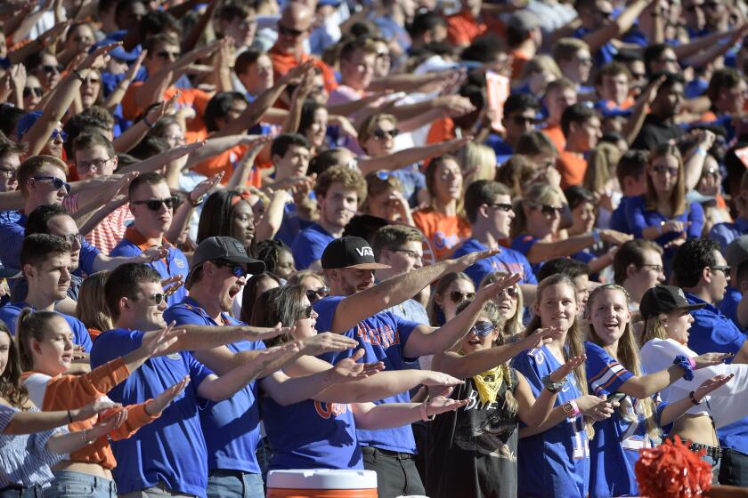 Florida fans cheer in the stands during the first half of an NCAA college football game against Missouri Saturday, Nov. 3, 2018, in Gainesville, Fla. (AP Photo/Phelan M. Ebenhack)