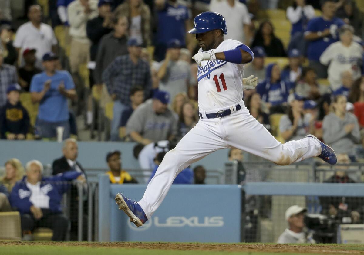 Dodgers shortstop Jimmy Rollins scores against his former team, the Phillies, on a double by Joc Pederson on July 6.