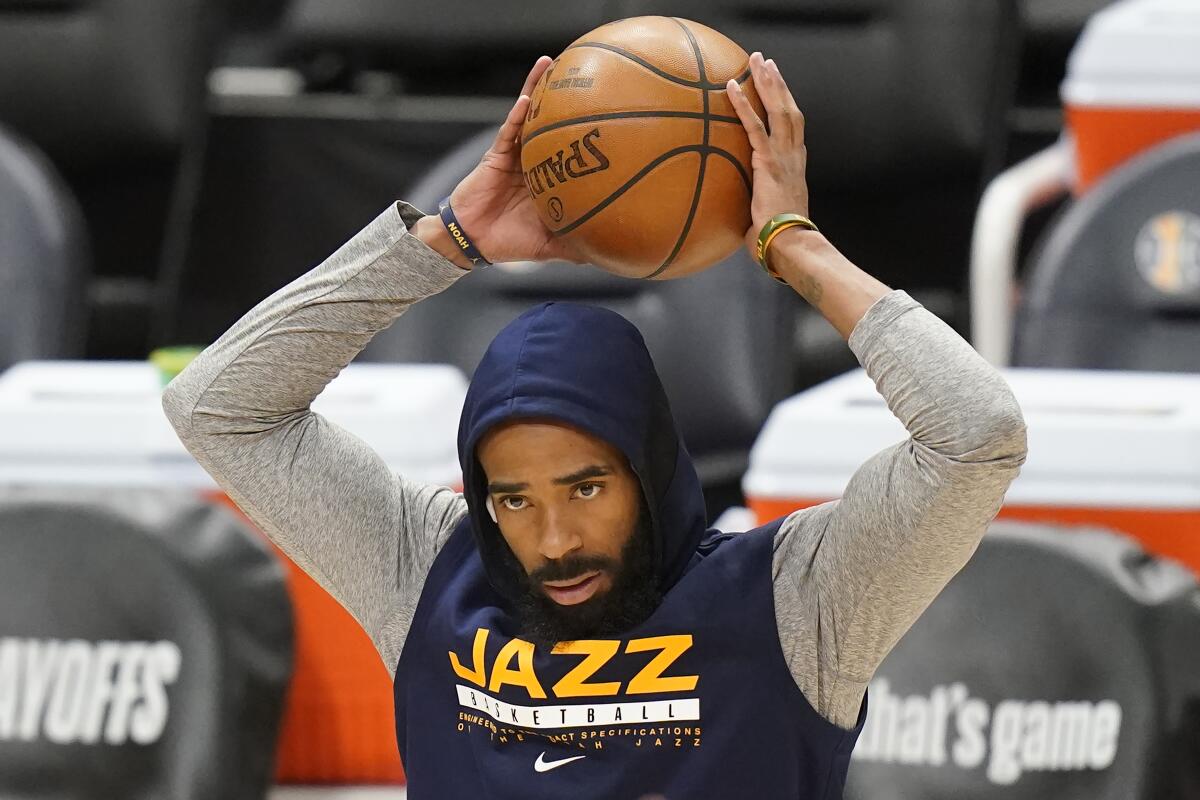 Utah Jazz guard Mike Conley stands on the court.