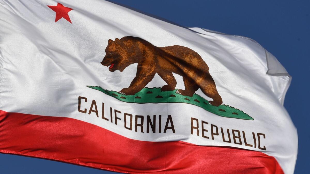 The California state flag flies outside Los Angeles City Hall.