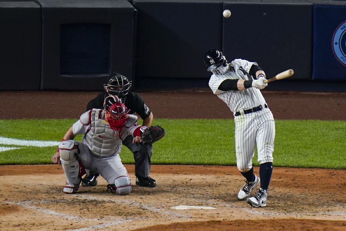 New York Yankees' Clint Frazier hits a three-run home run during the sixth inning of a baseball game against the Boston Red Sox Saturday, Aug. 15, 2020, in New York. (AP Photo/Frank Franklin II)