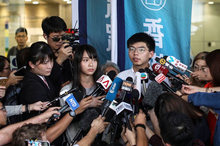 Mandatory Credit: Photo by JEROME FAVRE/EPA-EFE/REX (10375239a) Demosisto leaders Joshua Wong (C-R) and Demosisto member Agnes Chow (C-L) speak to the press after they were released on bail in Wan Chai police headquarters, Hong Kong, China, 30 August 2019. According to reports on 30 August 2019, political activist and Demosisto leader Joshua Wong and Fellow Demosisto member Agnes Chow was arrested for their involvement in an unlawful assembly during the besieging of the Wan Chai police headquarters on June 21. For over two months, Hong Kong has been gripped by mass protests, which began in June over a now-suspended extradition bill to China and have developed into an anti-government movement. Demosisto leader Joshua Wong and Fellow Demosisto member Agnes Chow released on bail, Hong Kong, China - 30 Aug 2019 ** Usable by LA, CT and MoD ONLY **
