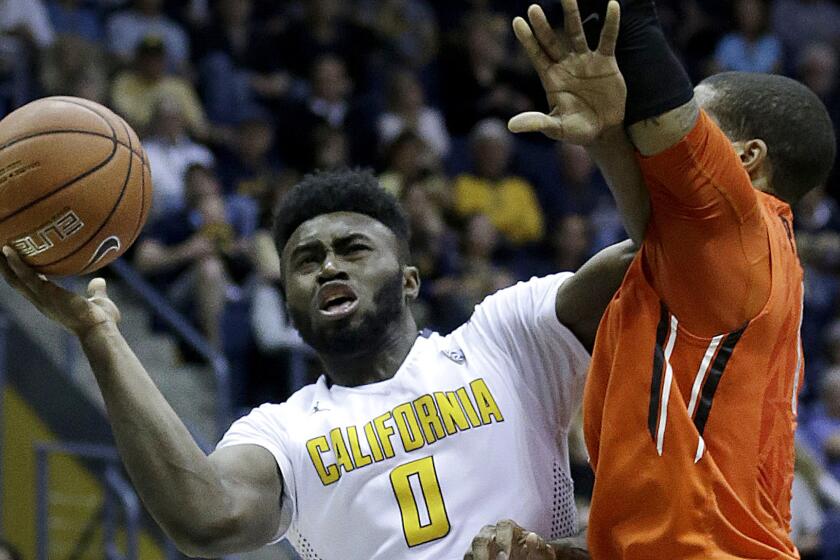 Jaylen Brown drives to the basket against an Oregon State defender during a game on Feb. 13.