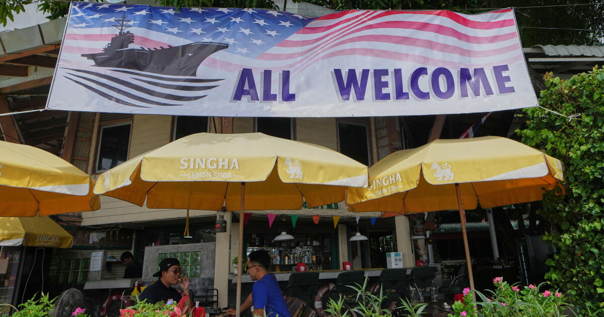 Photo: Los Angeles Times Customers of a restaurant sit under a banner in Pattaya, Thailand, on Sept. 1, 2026. (AP Photo/Sakchai Lalit)