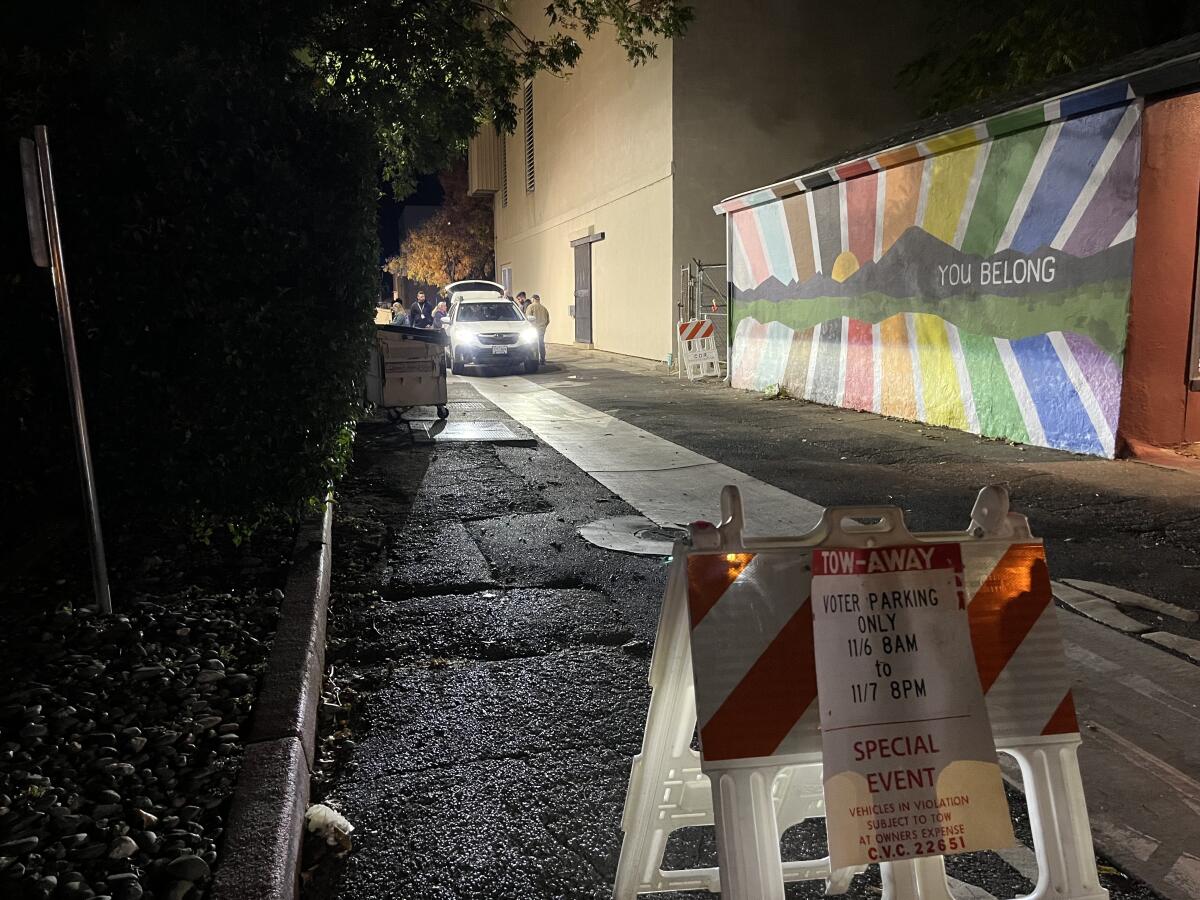 The closed alleyway behind the Shasta County elections office in Redding, with a security guard manning a