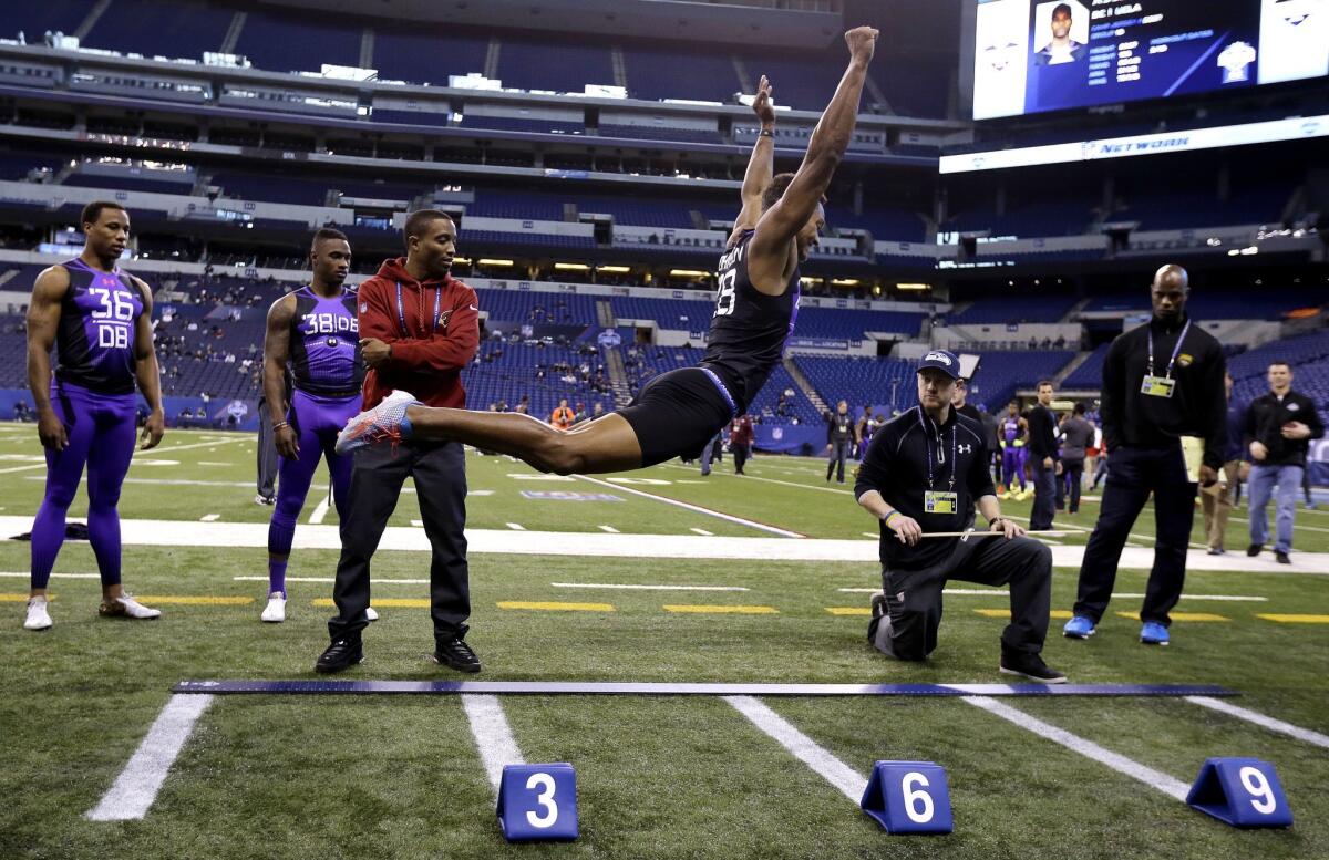 Connecticut defensive back Byron Jones takes a leap at the NFL scouting combine Monday in Indianapolis.