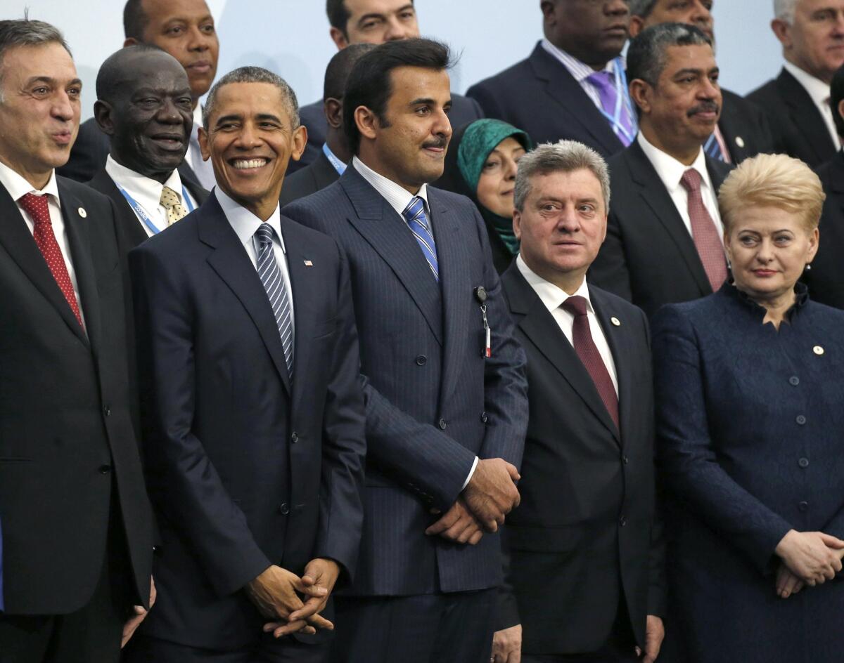 President Obama poses with world leaders for a group photo at the Paris climate change conference on Nov. 30.