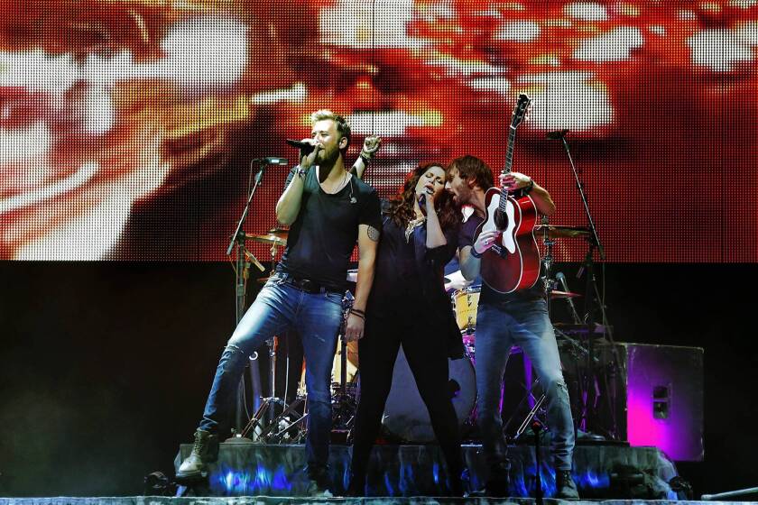 Lady Antebellum members Charles Kelley, left, Hillary Scott and Dave Haywood perform at the Stagecoach festival.