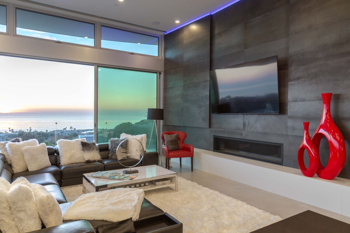 Raj Swenson chose modern blacks, grays and whites as primary colors in a new home in La Jolla to complement the ocean view.