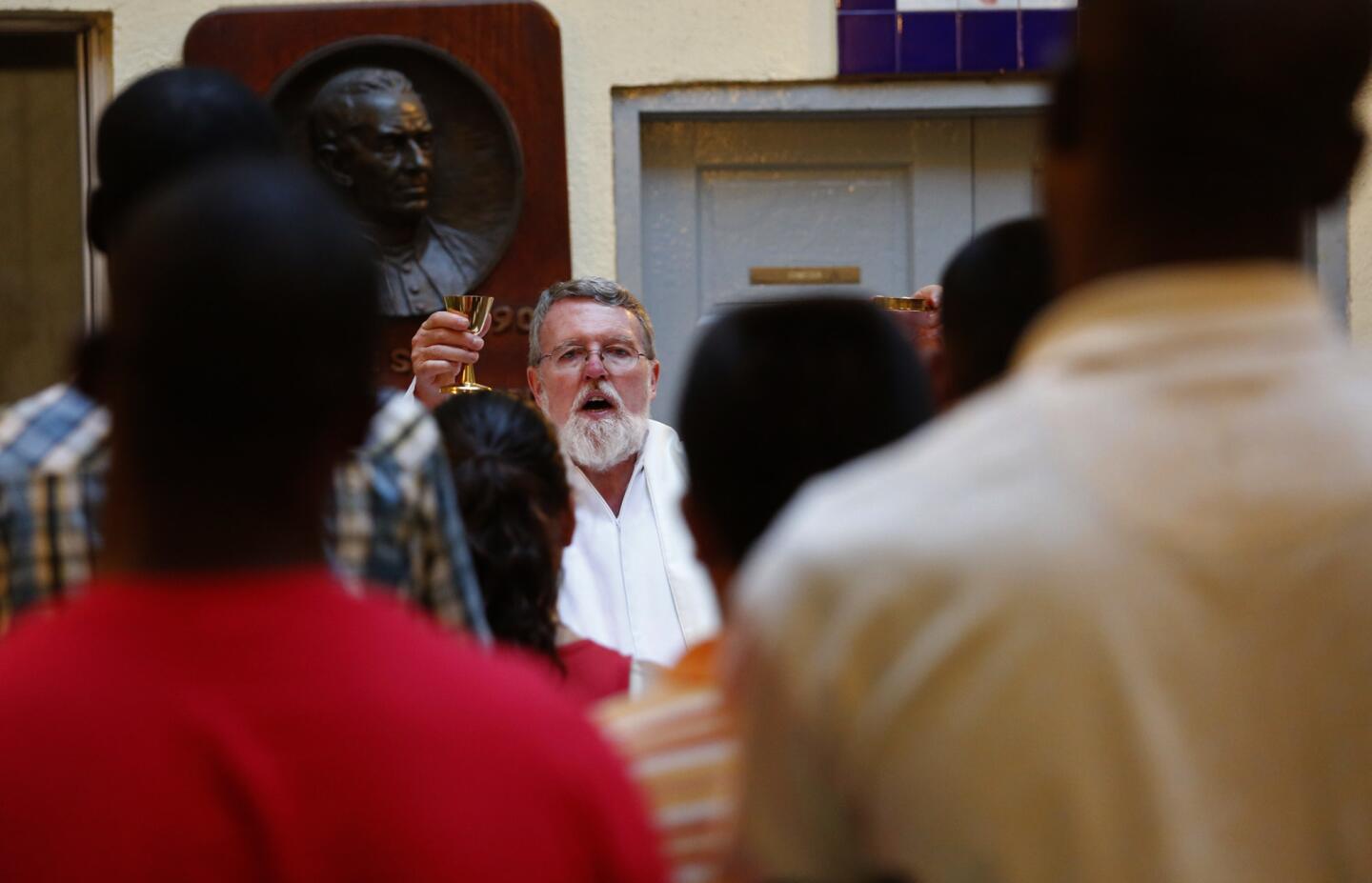 Father Patrick Murphy celebratesMass at the Casa del Migrante shelter in Tijuana, Mexico.