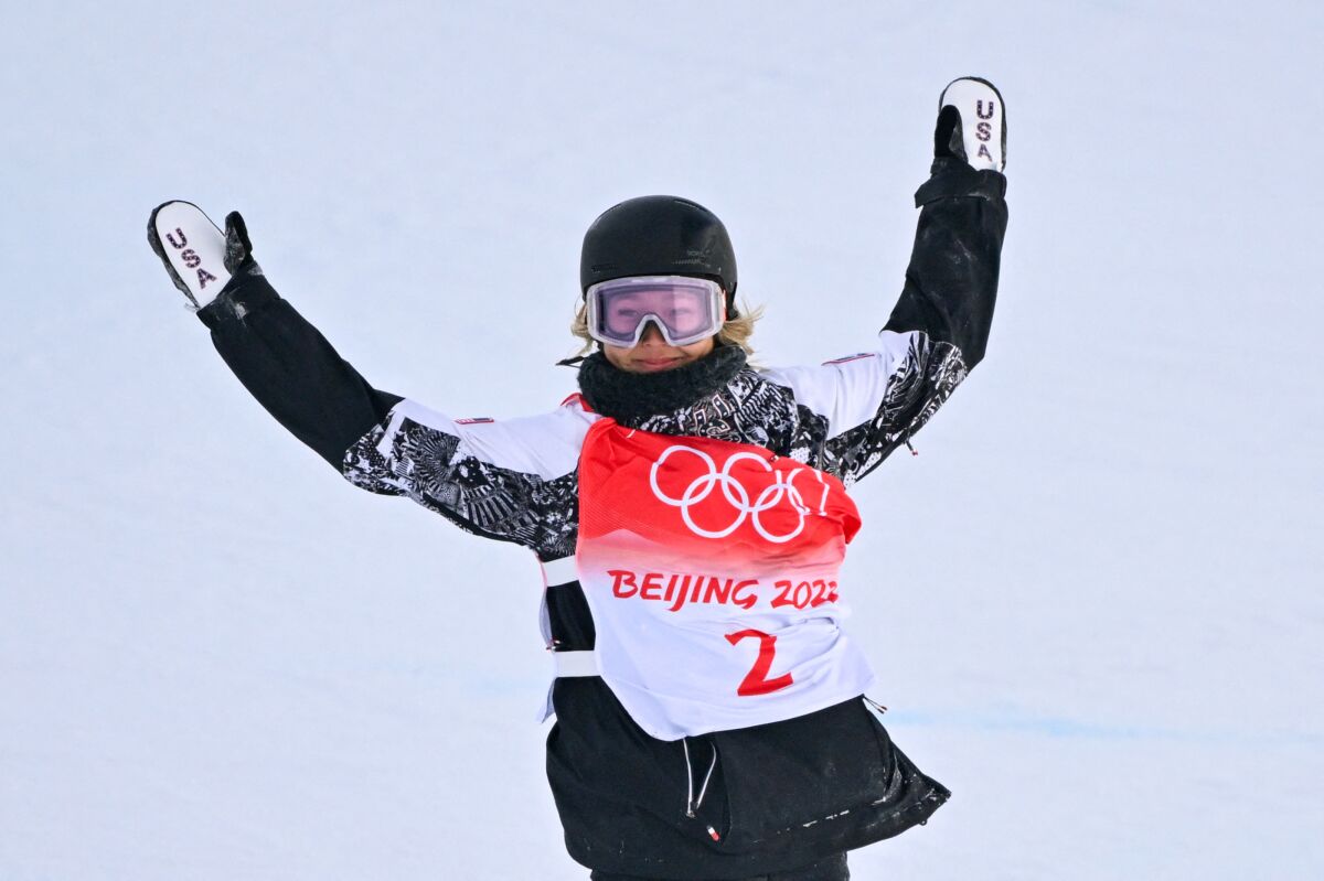 USA's Chloe Kim reacts as she wins the snowboard women's halfpipe final run.