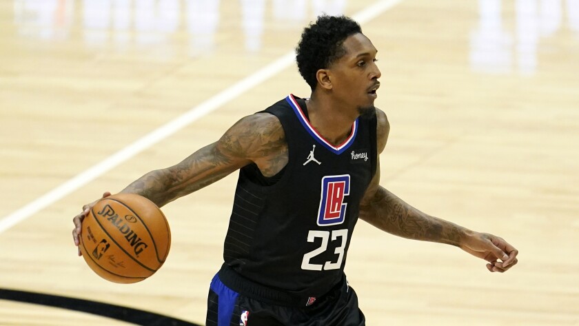 Clippers guard Lou Williams controls the ball during a game.