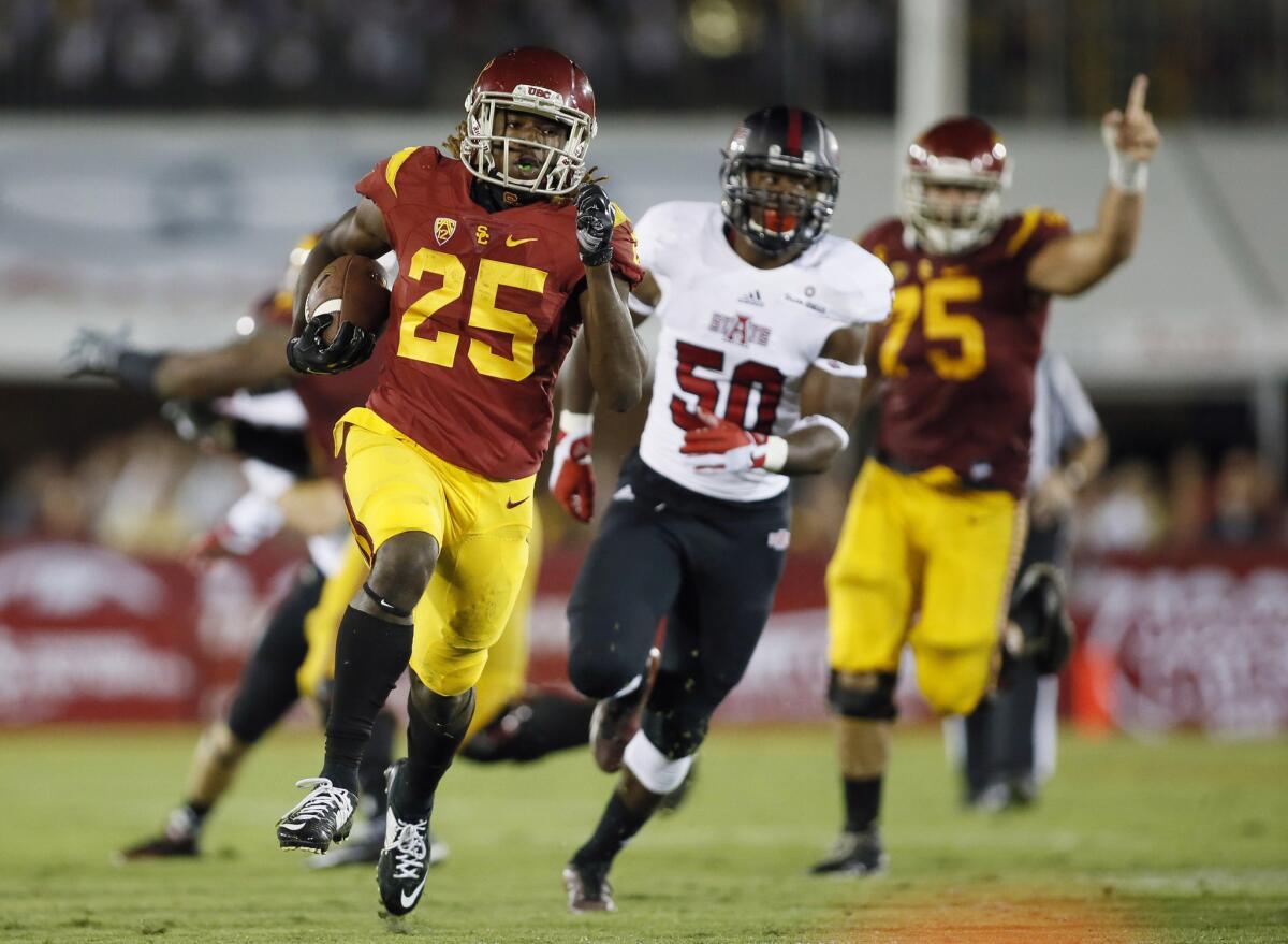 USC freshman running back Ronald Jones II runs for a 44-yard touchdown with Arkansas State linebacker Austin Copeland chasing him.