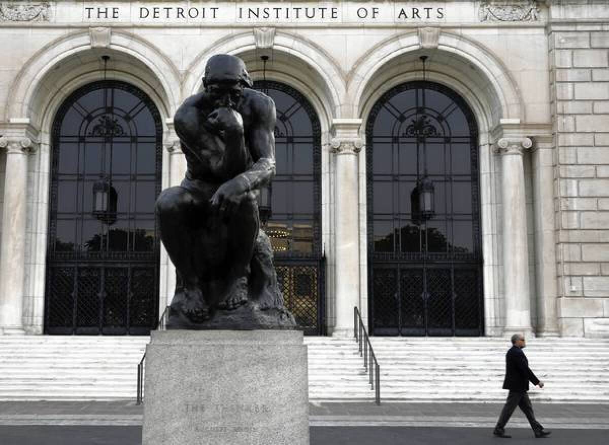 "The Thinker," a bronze sculpture by Auguste Rodin, is seen outside the Detroit Institute of Arts.