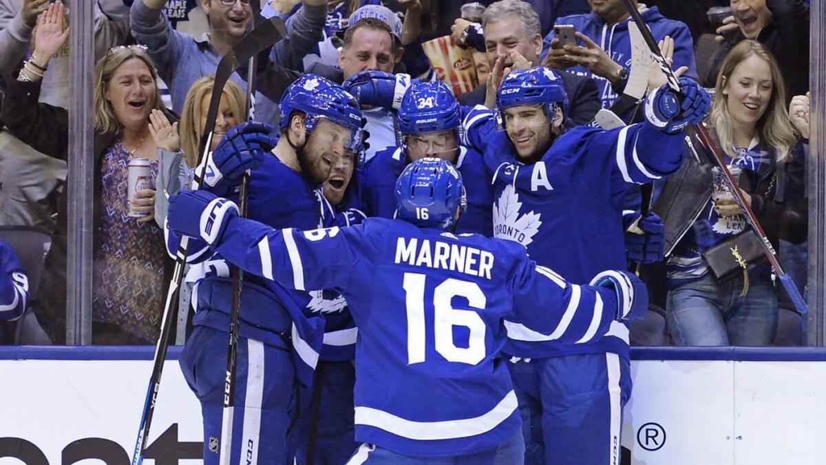 The Toronto Maple Leafs celebrate after Auston Matthews scores during Monday's win over the Boston Bruins.