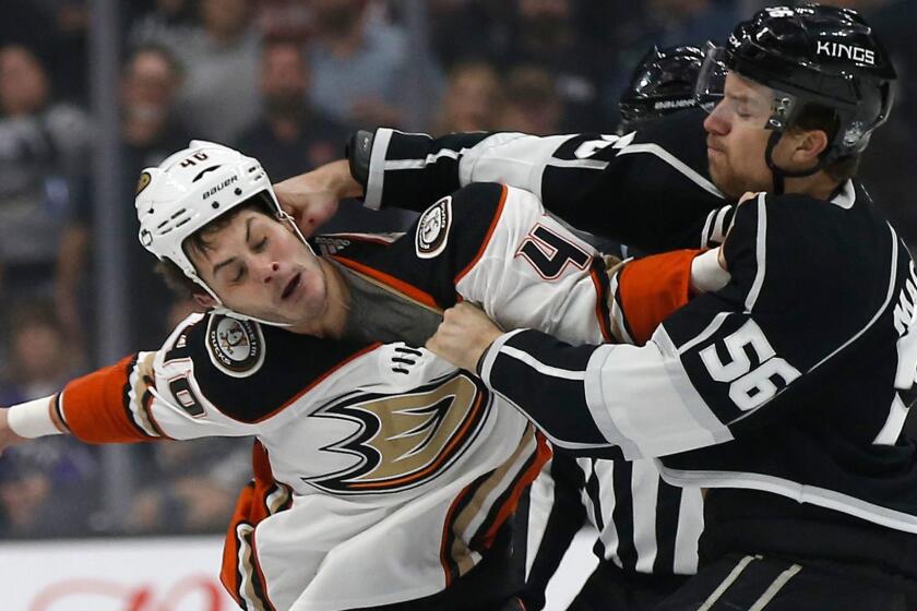 Los Angeles Kings defenseman Kurtis MacDermid, right, fights with Anaheim Ducks right wing Jared Boll during the first period of an NHL hockey game in Los Angeles, Saturday, Jan. 13, 2018. (AP Photo/Alex Gallardo)