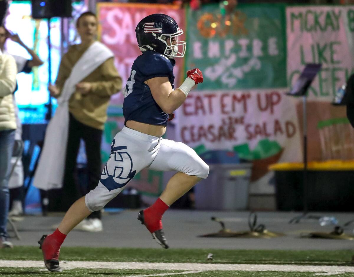 Newport Harbor running back Robby Crowell scores in the CIF Southern Section Division 4 playoff game against Valencia.