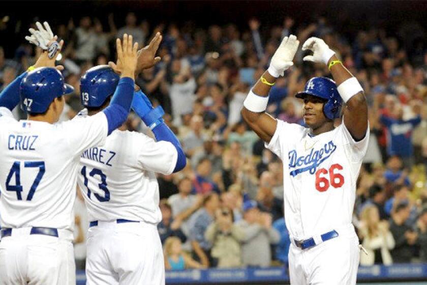 Yasiel Puig's grand slam in the bottom of the eighth inning gave the rookie outfielder his third home run in four games, and cranked the Dodgers to a 5-0 victory over the Atlanta Braves.