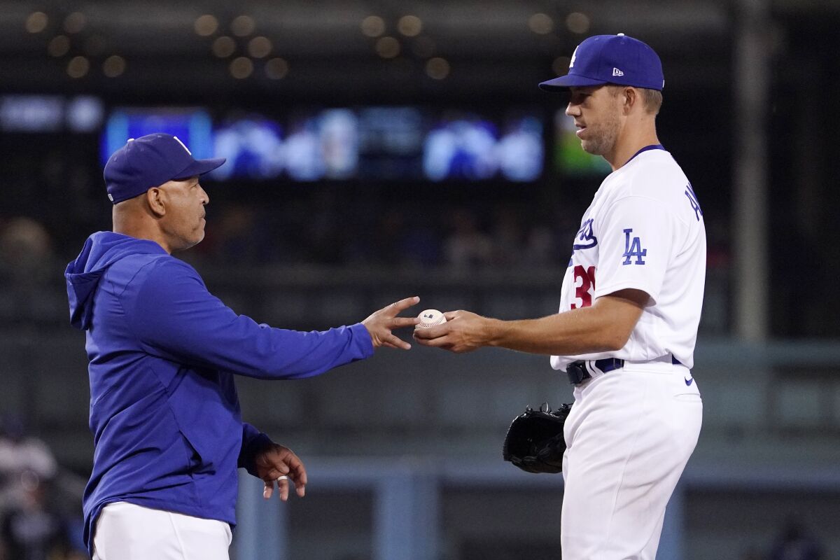 Dodgers manager Dave Roberts takes starting pitcher Tyler Anderson out of the game.