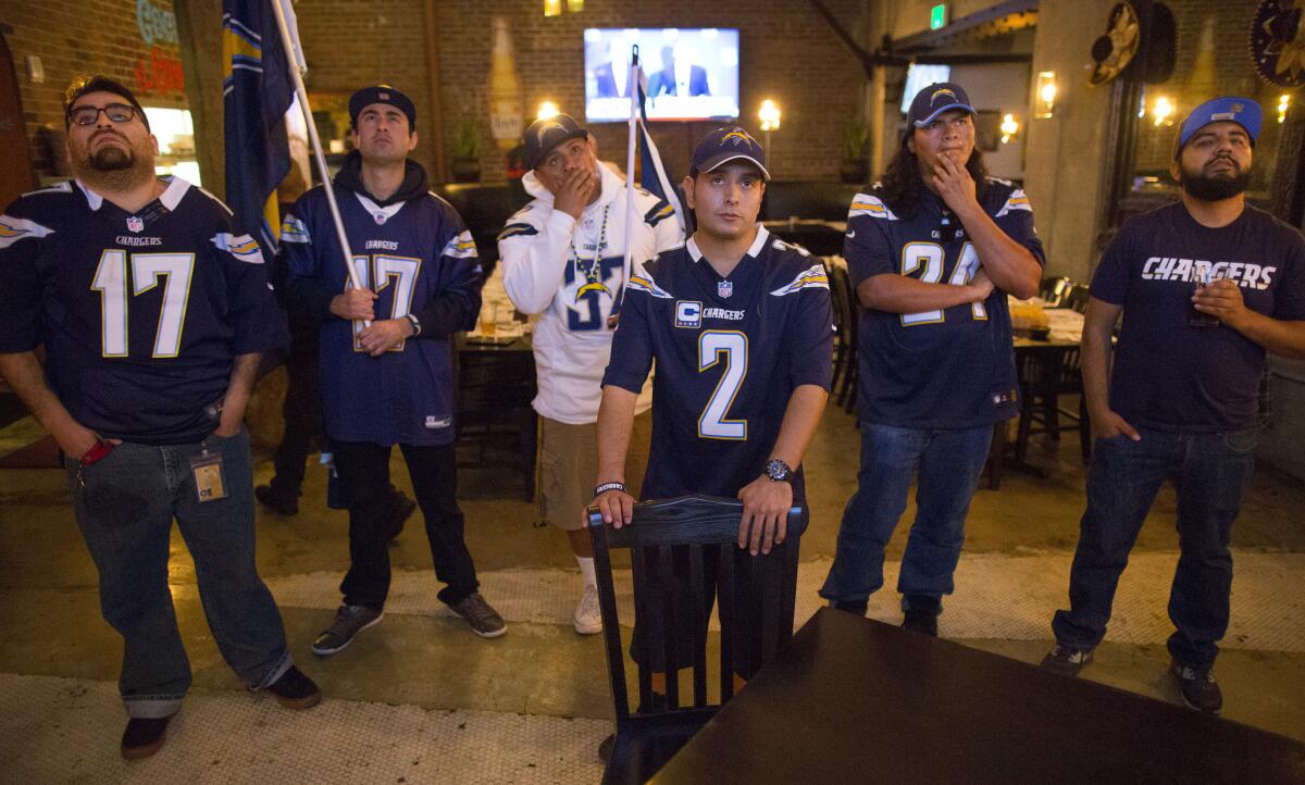 Los Angeles fans of the San Diego Chargers react to news from the NFL owners meeting during a meet-up at El Compadre Restaurant on Jan. 12.