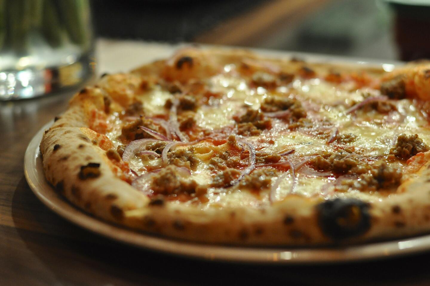 Fennel-pork sausage pizza with red onions and wild fennel pollen at All'Aqua in Atwater Village.