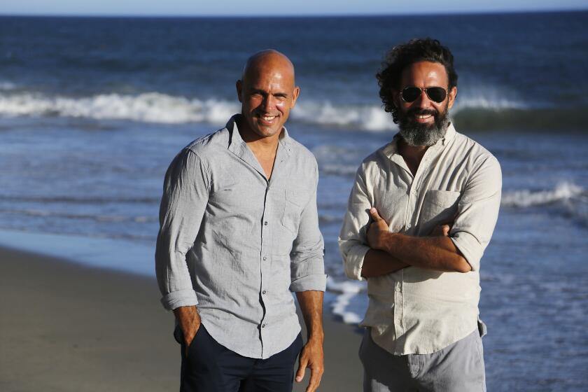 World champion surfer Kelly Slater, left, and creative director John Moore at the Aug. 29, 2015, launch party celebrating Slater's new Outerknown label — which both men are wearing.